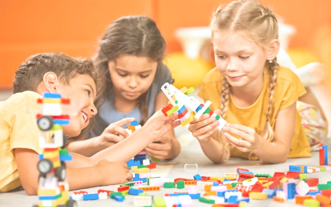 children playing with lego blocks